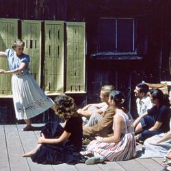 <strong>Ann Hutchinson Guest (born on November 3, 1918) was photographed by John Lindquist in 1953 teaching a Labanotation class on the Tea Garden platform, wearing a skirt she embroidered with dance notation symbols.</strong>